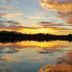 Country Inn & Suites by Radisson, Bemidji, MN lakeside sunset reflecting on calm water