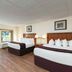 River Terrace Resort & Convention Center in Gatlinburg guest room with two beds and balcony doors