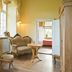 Hotel & Restaurant Gutshaus Ludorf in Bollewick: elegant room with freestanding bathtub, sofa and chairs