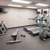 Courtyard by Marriott Tuscaloosa fitness room with treadmills, exercise bikes and weight bench