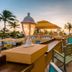 Amsterdam Manor Beach Resort in Noord with sunset rooftop bar seating and ocean-view terrace