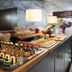 Breakfast buffet at Voco Bonnington Dubai By IHG in Dubai with pastries, fruit, and hot drinks