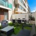 Casas e Quintas de Praia in Aveiro: outdoor patio with seating and dining table beside the building