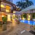 Hotel El Marqués by Faranda Boutique in Cartagena: courtyard pool with lounge chairs and umbrellas at dusk