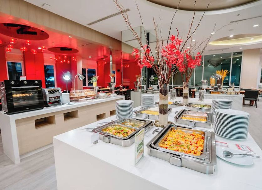 Sleep With Me Hotel Design Hotel @ Patong buffet dining area with hot food trays and red accent lighting