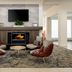 Hilton Garden Inn Roseville lobby seating area with fireplace and wall-mounted TV
