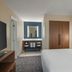 Residence Inn by Marriott Indianapolis Airport guest room with king bed and vanity