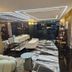 The Park Residence Bangkok lobby lounge with geometric ceiling lights and marble-patterned flooring