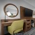 Hampton Inn Yorkville guest room with desk, wall-mounted TV, and upholstered chair