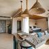 Soulshine Bali in Ubud: open-air lounge with sofa seating, woven pendant lights and tropical view