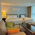 Aventree Hotel Busan guest room with two beds, sofa seating and large window in Busan