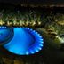 Viale Cataratas Hotel & Eventos in Foz do Iguaçu, illuminated outdoor pool at night with palm trees