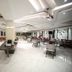 The Byke Suraj Plaza, Thāne: spacious hotel dining hall with modern ceiling lights and glossy marble floors