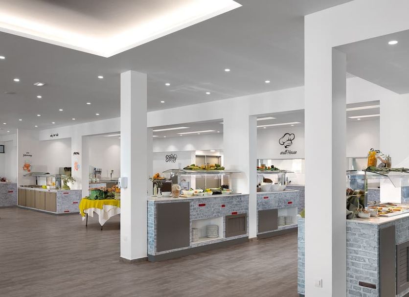 Olive Garden Hotel in Lardos buffet dining area with serving counters and modern open layout
