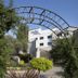 Garden Court Eastgate in Johannesburg, hotel entrance framed by a landscaped archway and trees