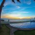 Plaza Pelicanos Grand Beach Resort in Puerto Vallarta with oceanfront pool at sunset