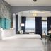La Copa Inn Beach Hotel South Padre Island guest room with two beds, balcony ocean view, and desk