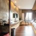 Tamsabai Hotel, Nakhon Sawan guest room with bed, desk, wall-mounted TV and balcony view