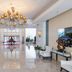 Haiqing Hotel Qingdao grand lobby with chandelier, marble floors, seating and central staircase