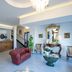La Panoramica Hotel in Castellammare di Stabia lobby with red sofa, chandelier and reception desk
