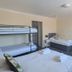 The Bell, Bury St. Edmunds: family room with bunk bed, twin beds, TV and armchair
