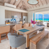 Sailrock South Caicos, Cockburn Harbour villa living area with oceanfront view and open terrace