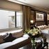 Apollo Hotel in Johannesburg guest room with twin beds, sofa seating, and city view window