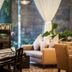 Super Candle Hotel Hanoi lobby with grand piano, sofa seating and tall windows