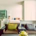 Raha Grand Hotel Patong living area with lounge chairs, bathtub nook, and large window curtains