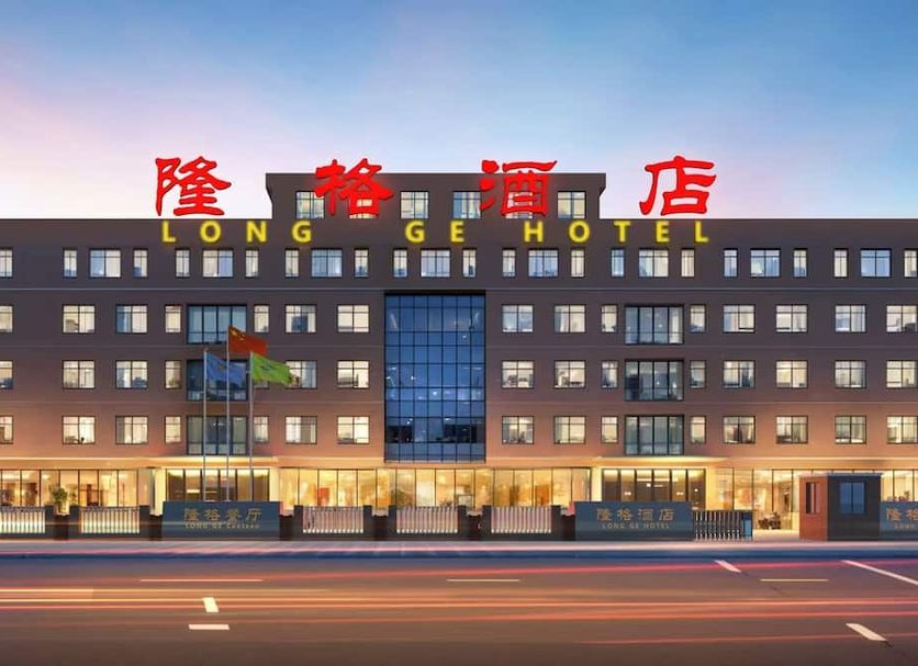 Long Ge Hotel in Beijing exterior at dusk with illuminated windows and road in front