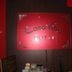 Casavilla Travellers Lodge Pudu in Kuala Lumpur with a red hotel sign on a dark wood wall