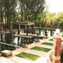 Velmore Hotel & Spa in Pretoria features an outdoor reflecting pool with brick pillars and trees