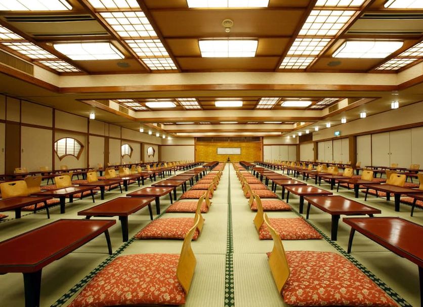 Yorokobi no Yado Takamatsu in Kusatsu: spacious tatami dining hall with low tables and floor cushions