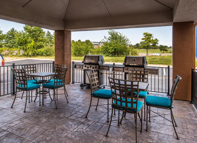 Candlewood Suites Topeka West By IHG patio with tables, grills, and outdoor seating in Topeka
