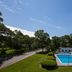 Blue Rock Resort in South Yarmouth with outdoor pool, lounge chairs and landscaped grounds