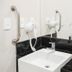 Transamerica Wise Indaiatuba bathroom sink with wall-mounted hair dryer and grab bars