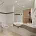 Ramada by Wyndham Wakefield bathroom in Ossett with shower, toilet, sink and large mirror