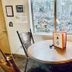 Lower Unit-Yosemite Woods-Inside Yosemite in Yosemite West, table and chairs beside a window with forest view