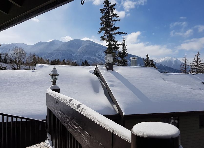 Banff International Hostel in Banff with snow-covered roofs and mountain views