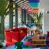 citizenM Rome Isola Tiberina lounge with colorful seating and patterned ceiling in Rome