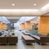 West Coast Suites At Ubc in Vancouver lobby with modern seating and glass railings