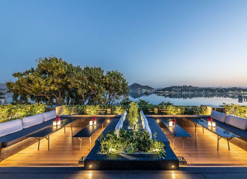 Hotel Lakend in Udaipur rooftop terrace with seating and lake views at sunset