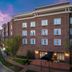 Homewood Suites by Hilton Huntsville-Village of Providence exterior at dusk with brick facade and driveway