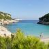 Finca Sa Carrotja in Ses Salines with a turquoise cove beach and rocky cliffs