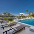 Hilton Garden Inn San Juan Condado rooftop pool with loungers and city view in San Juan