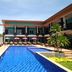 Seashell Resort Krabi in Krabi with outdoor pool, sun loungers, and poolside umbrellas