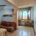 Hotel Marbella Playa Larga in Ixtapa room with bed, sofa, desk by window, and tiled floor