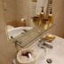 Cà Furlan Venice bathroom sink with mirror, glass shelf and gold toiletries