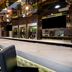 Hampton Inn New York-JFK in Queens bar area with high stools, mirrored ceiling, and long counter