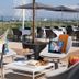 Thalazur Ouistreham - Hôtel & Spa terrace with outdoor seating, tables, umbrellas and sea view in Ouistreham